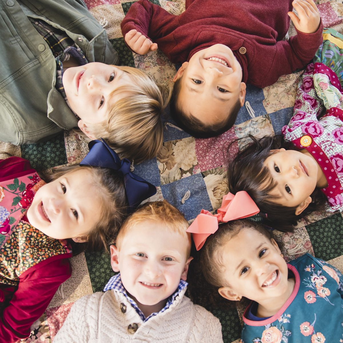 kids laying down in a circle
